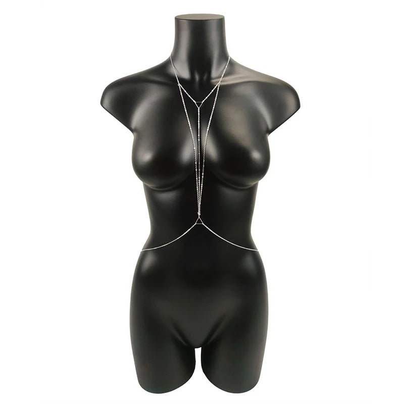 Black mannequin with a necklace on a white background