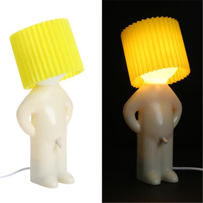 Person-shaped lamps with yellow lampshades on a white background