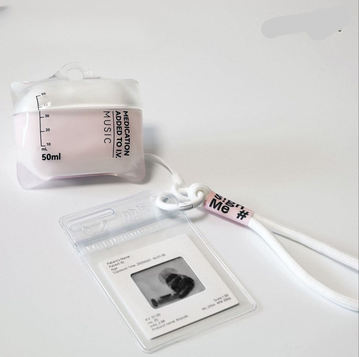 Clear earphone case with a small bottle labeled 'Medication Added To Mix' on a white background