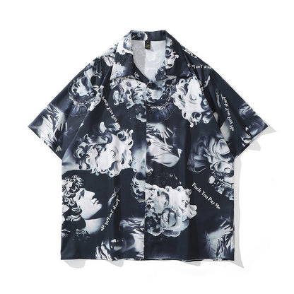 A short-sleeved chemical fiber shirt featuring a black and white floral pattern with a lapel collar.