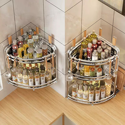 Two 360-degree rotating spice racks filled with various bottles and containers on a kitchen counter.