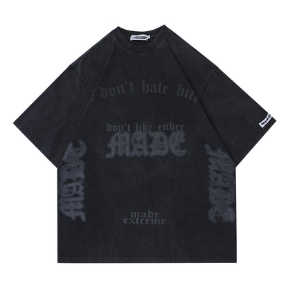 Black oversized t-shirt with text on a white background