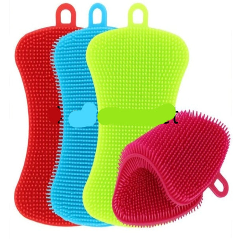 A collection of colorful silicone dishwashing brushes in blue, yellow, green, and orange, displayed on a patterned surface.
