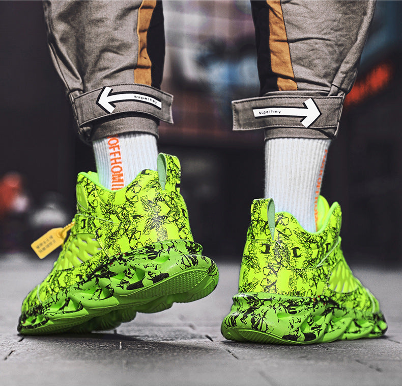 Green sneakers with black patterns worn by a person on a blurred street background