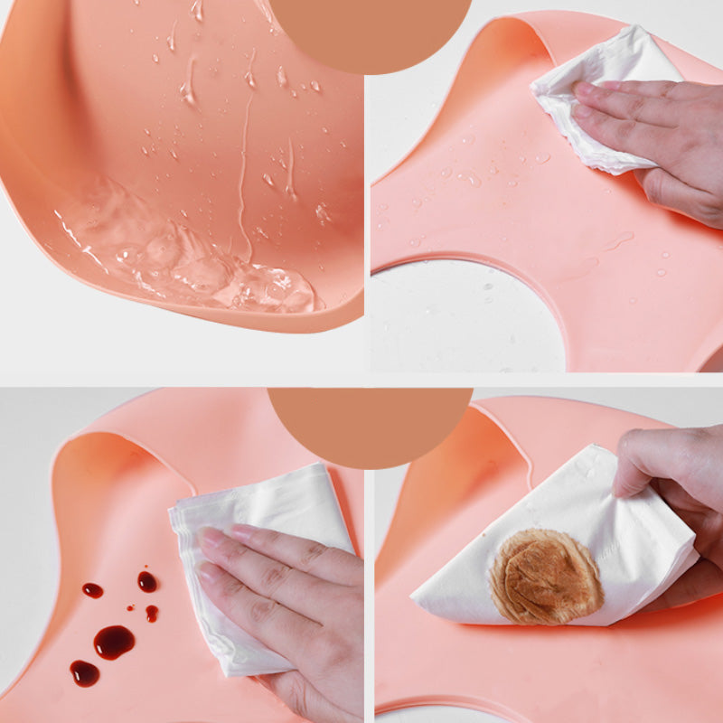Step-by-step process of cleaning a pink silicone mat with a white cloth.
