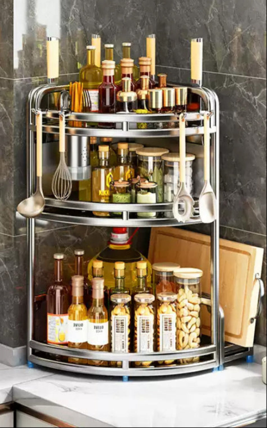 Corner kitchen rack with bottles, jars, and utensils against a tiled wall.
