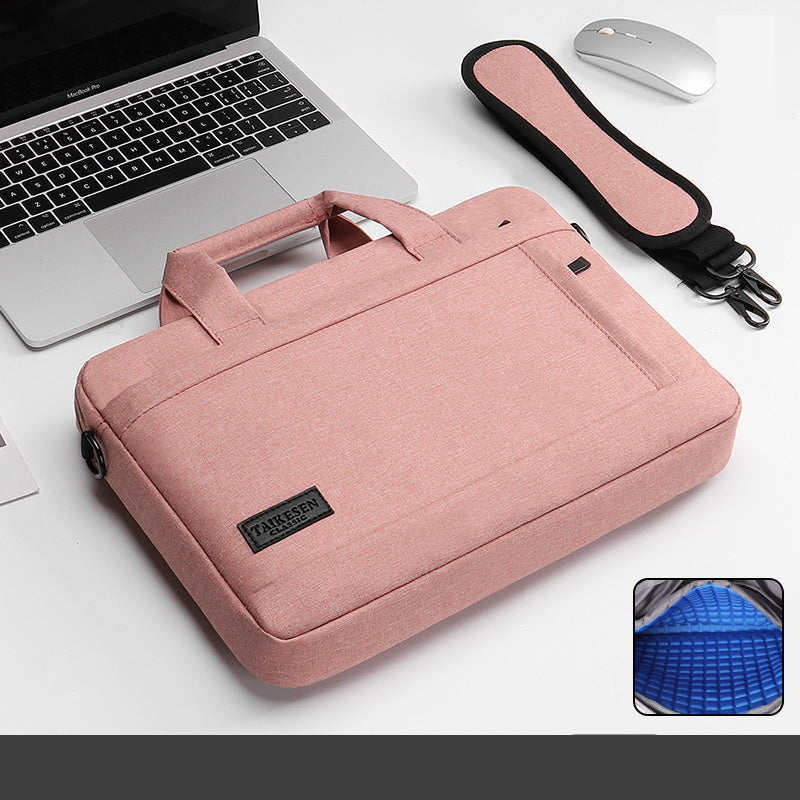 Pink laptop case with handle and shoulder strap on a white surface.