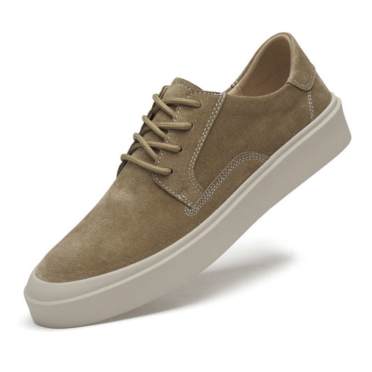 Brown suede sneaker with white sole on a white background