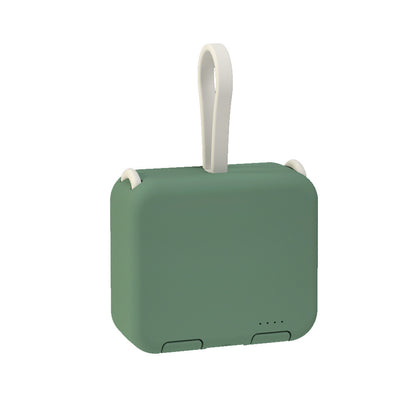 Green portable device with a white handle on a white background