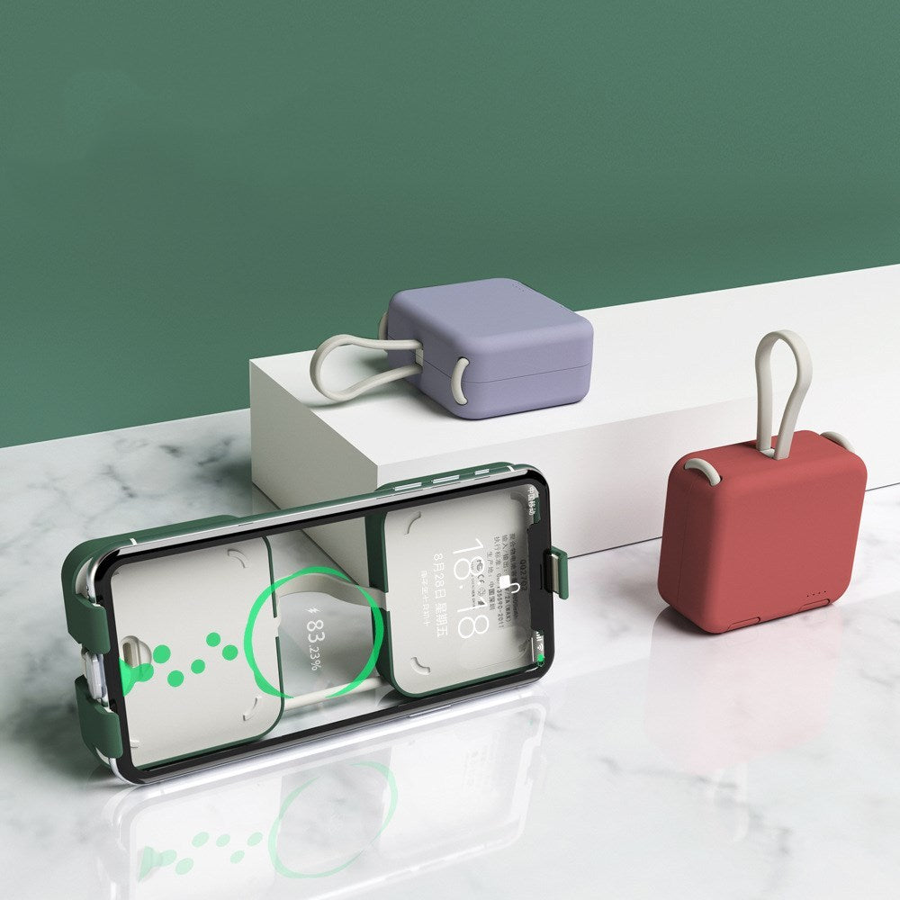 Smartphone with a protective case on a marble surface with a green background