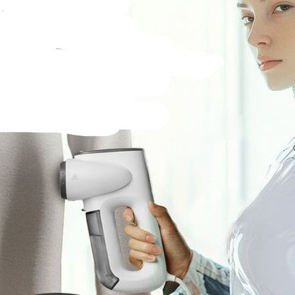 Person using a handheld vacuum iron on fabric with text about features.