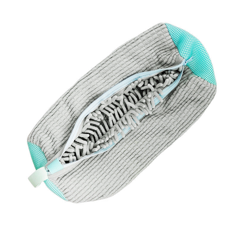 Gray cleaning pad with teal accents on a white background