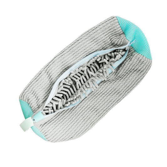 Gray cleaning pad with teal accents on a white background