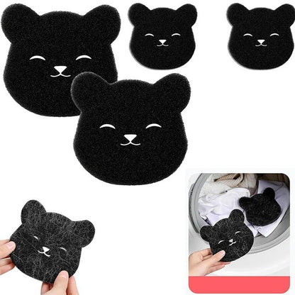 Black bear-shaped scrubs with a close-up inset showing their use on white cloths.