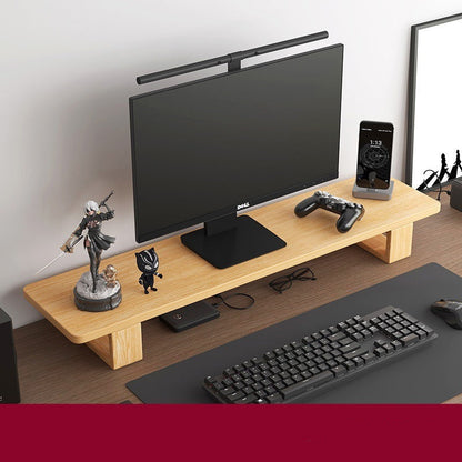 Monitor stand made of black walnut wood, with a computer monitor, keyboard, and various desk accessories on it, placed on a wooden floor against a white background.