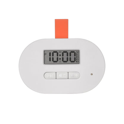 Digital clock with a white body and orange top on a white background