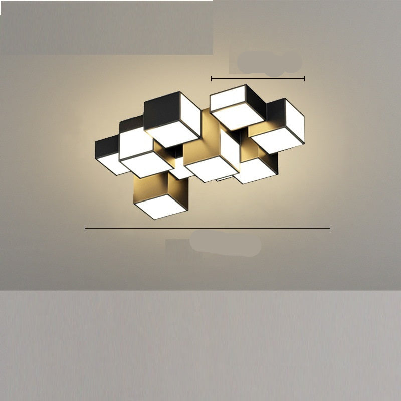 A modern black ceiling-mounted pendant light with multiple square-shaped灯heads hanging over a dining table in a contemporary room setting.