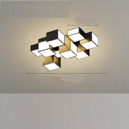 A modern black ceiling-mounted pendant light with multiple square-shaped灯heads hanging over a dining table in a contemporary room setting.
