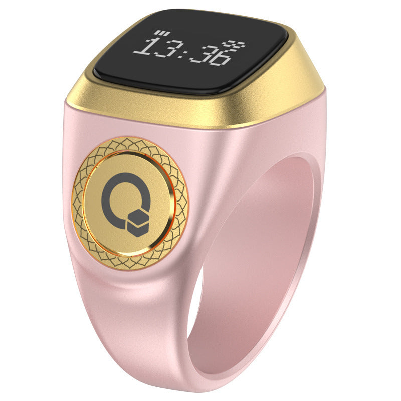 Smart ring with digital display and gold accents on a white background