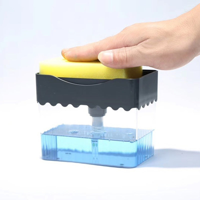Hand using a sponge in a blue dishwashing brush holder on a white background