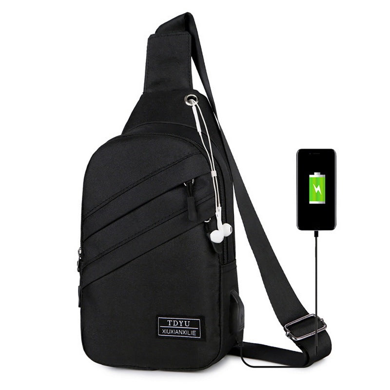 Black sling bag with USB port and smartphone on a white background