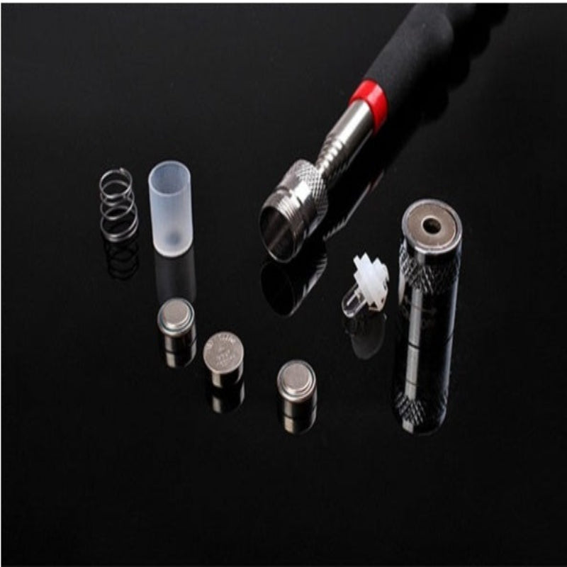 Collection of electronic components and tools on a black reflective surface
