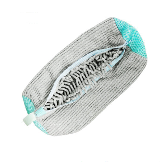 Gray and turquoise cleaning pad with zebra pattern on a white background