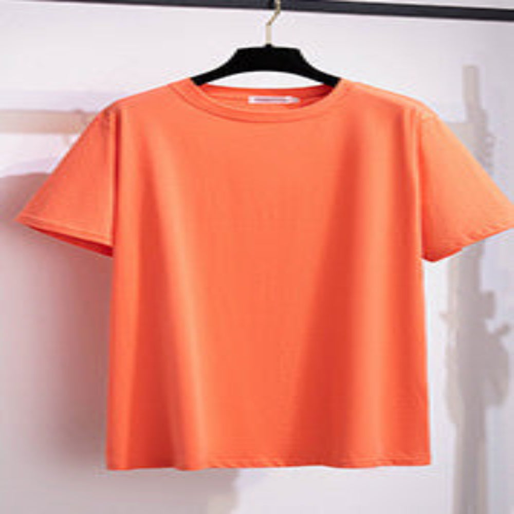 A selection of short-sleeved t-shirts in various solid colors, displayed on hangers in a row.