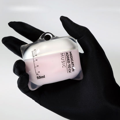 Hand holding a small container labeled 'Medication Added to IV Music' with black gloves on a white background