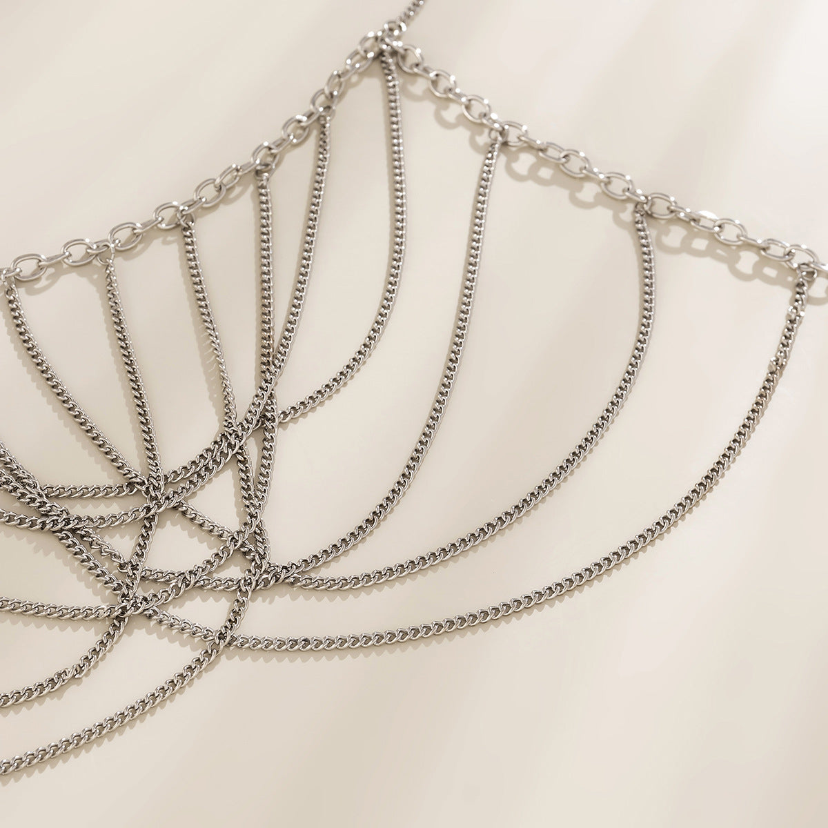Silver chain necklace on a light background
