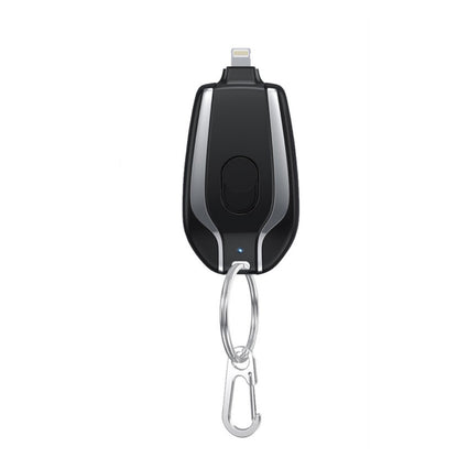 Black and silver electronic device with a carabiner on a white background