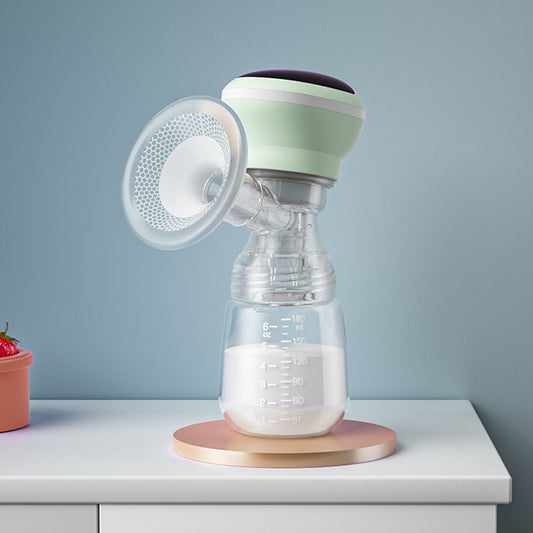 Breast pump with a bottle of milk on a white surface against a light blue background