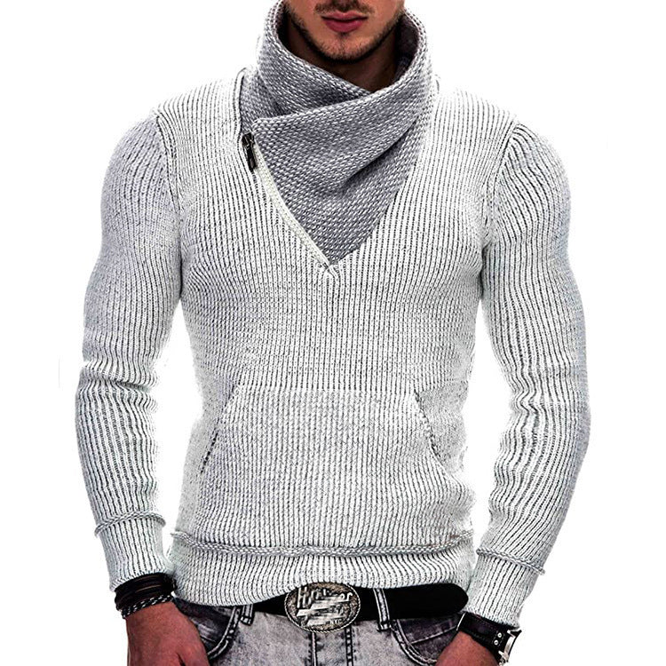Man wearing a gray knitted sweater with a V-neck on a white background