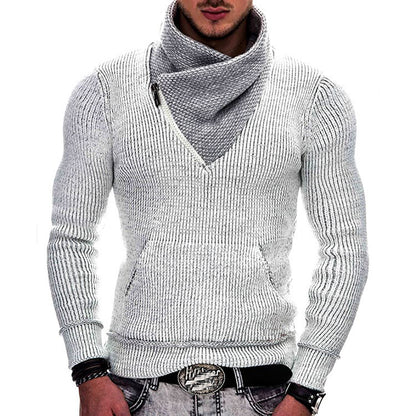 Man wearing a gray knitted sweater with a V-neck on a white background