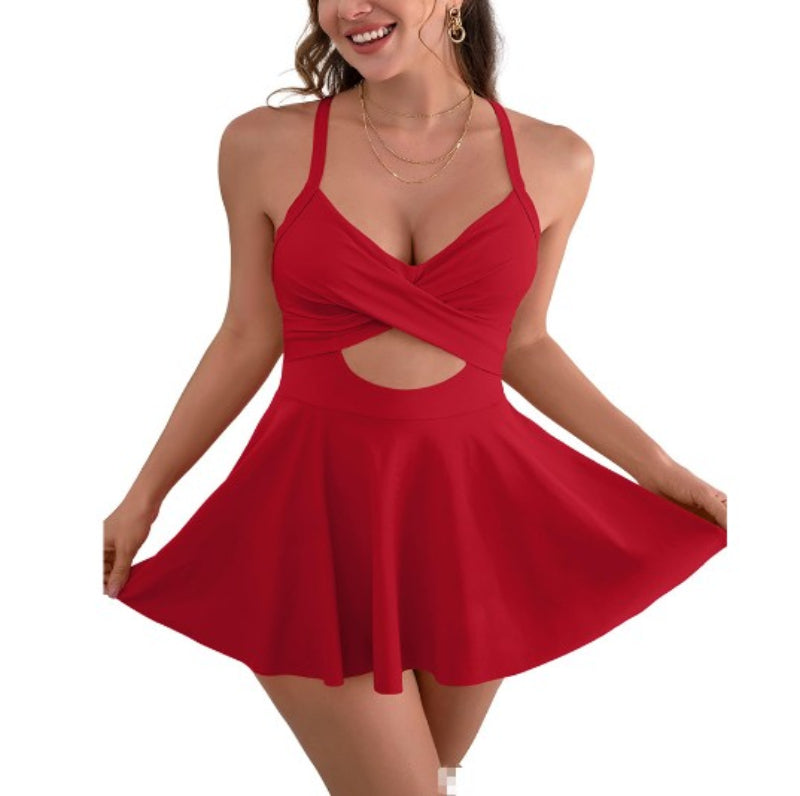 Woman wearing a red dress with cut-out design on a white background