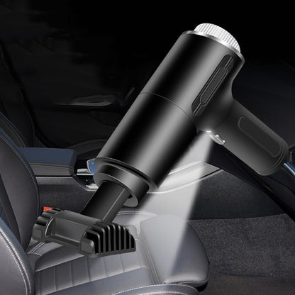 Black handheld vacuum cleaner on a gray background