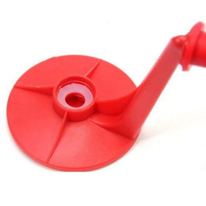 Red plastic component on a white background