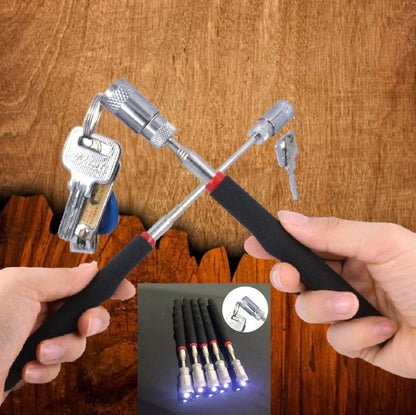 Two hands holding a multi-tool with LED lights against a wooden background