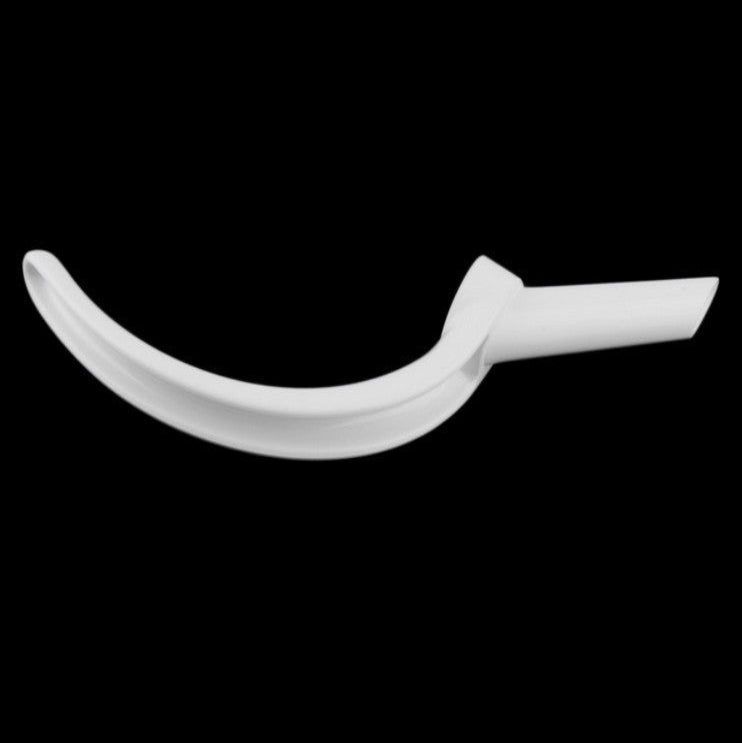 White curved object on a black background