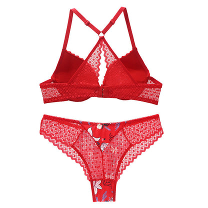 Red lace lingerie set on a white background