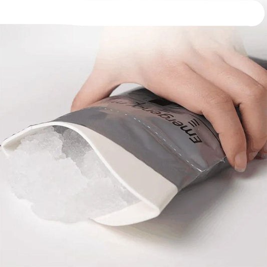 Hand holding a gray bag labeled 'ETRENGER' with text above it.