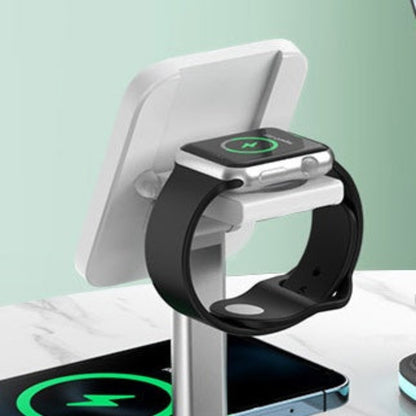 Smartwatch and phone on a wireless charging stand with a light green background