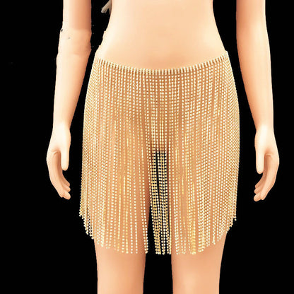 Mannequin wearing a gold fringe skirt on a plain background