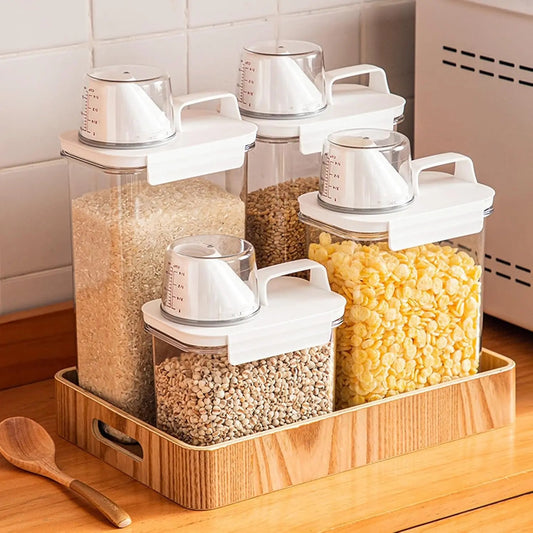 Kitchen storage solution with transparent containers holding cereals on a wooden tray.