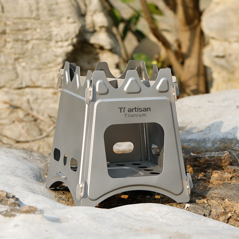 Titanium camping stove on a rock with a natural background