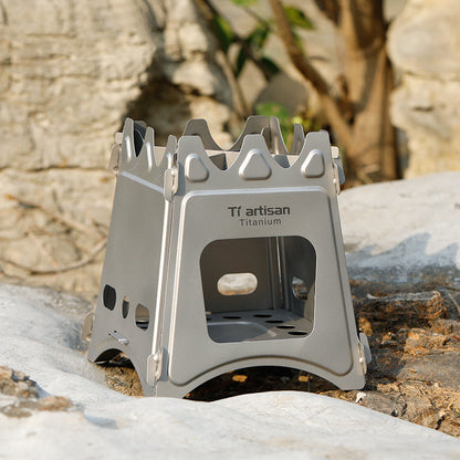 Titanium camping stove on a rock with a natural background