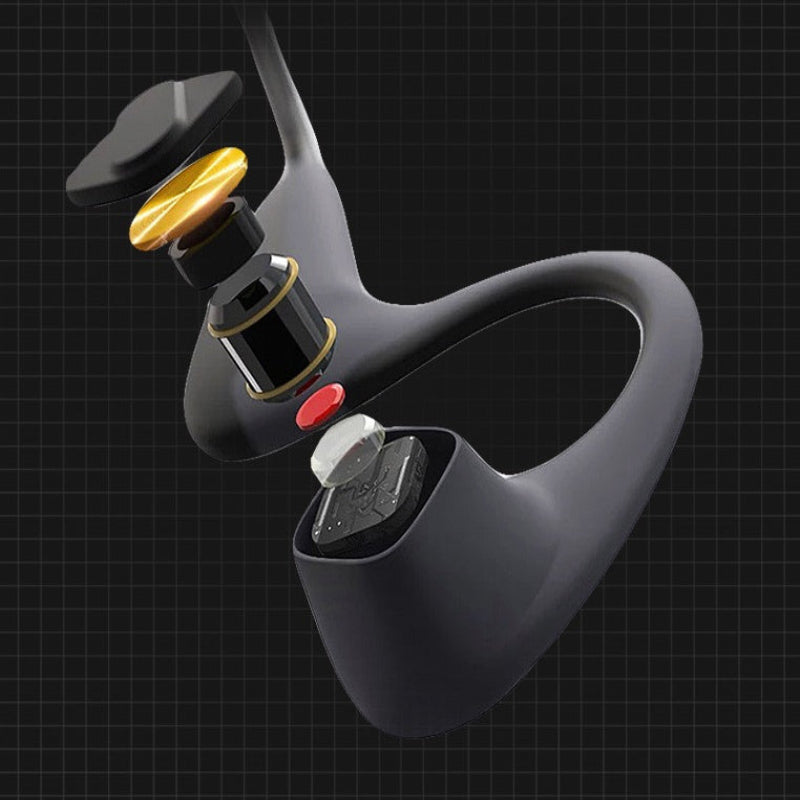 Close-up of a black electronic device with gold and red accents on a dark background