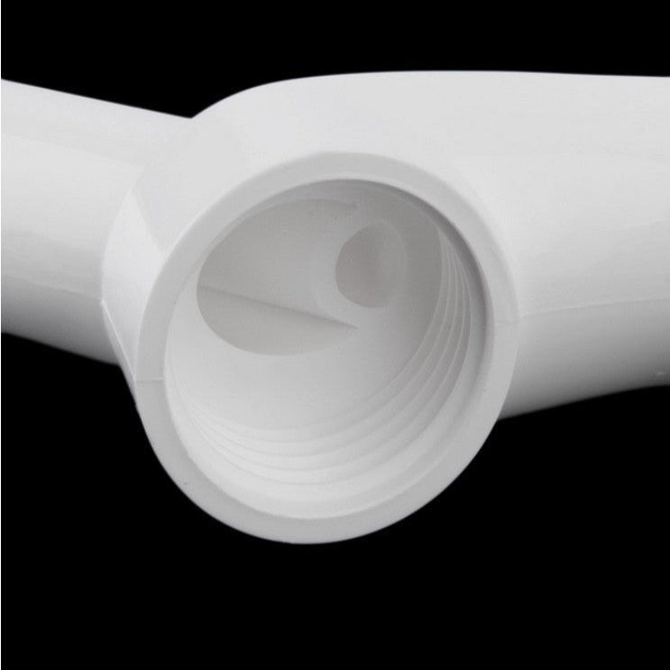 Close-up of a white plastic pipe on a black background