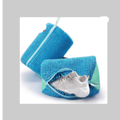 A gray and blue striped shoe bag with a zipper closure and a small white and blue label attached to it.