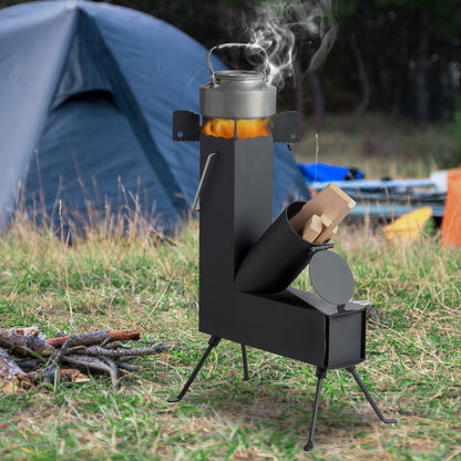 Portable camping stove with wood and smoke in front of a tent in a grassy area